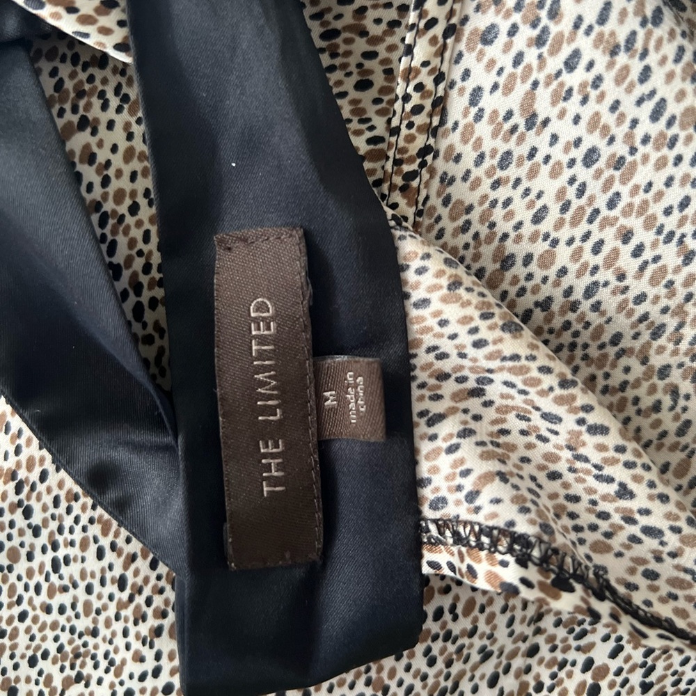 The limited brown printed halter back tie top
